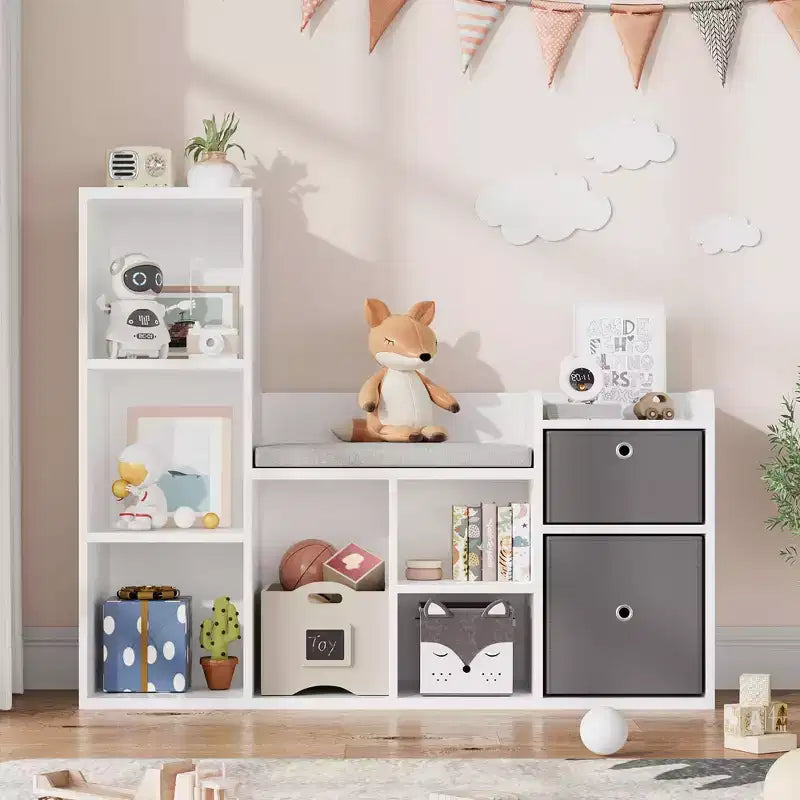 Libreria per bambini con larghezza di 112 cm, 6 scomparti, 2 cassetti, cuscino per seduta e organizer per giocattoli – Bianca