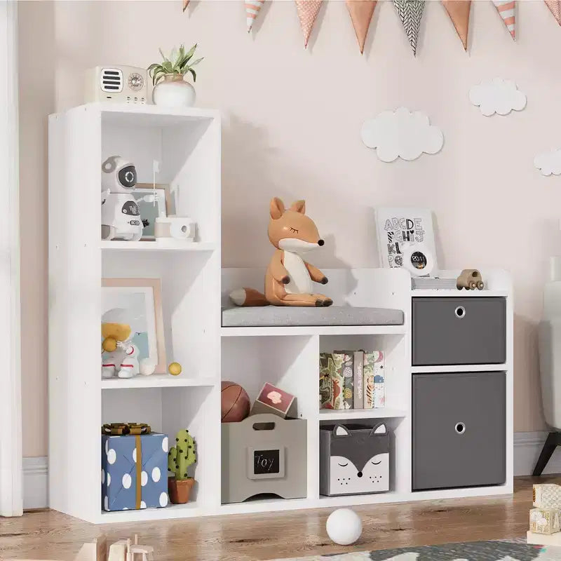 Libreria per bambini con larghezza di 112 cm, 6 scomparti, 2 cassetti, cuscino per seduta e organizer per giocattoli – Bianca